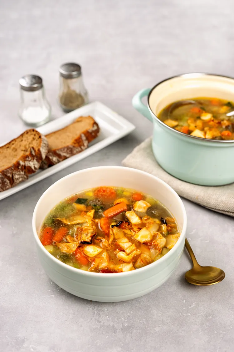 Almond chicken soup with sweet potato, kale and lime
