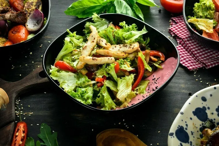 Asian chicken salad with mushrooms, carrots and red pepper