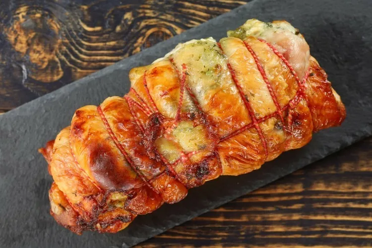 Rosemary and bacon-wrapped pork roast with white wine