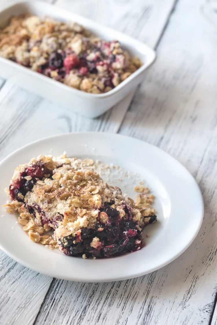 Baked blueberry banana oatmeal with cinnamon and maple syrup