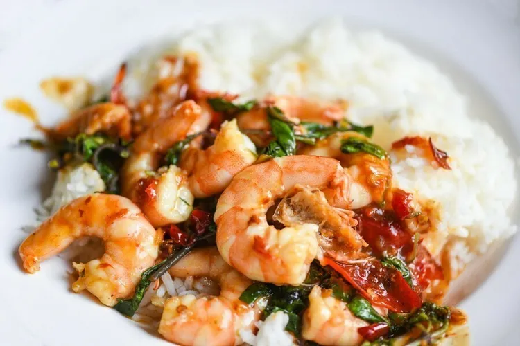 Coconut milk-infused brazilian honey garlic butter shrimp with white rice and black beans