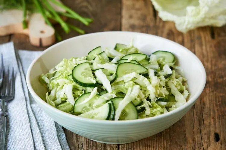 Cabbage cucumber salad with onion, olive oil, vinegar, lemon juice, salt and pepper