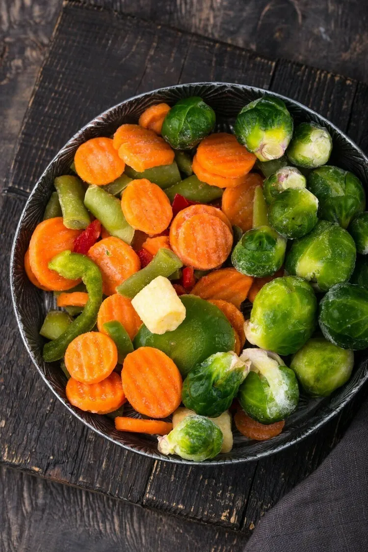 Roasted carrots and brussels sprouts with onion and butter