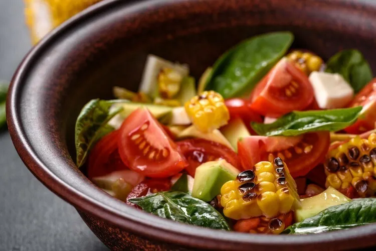 Grilled corn and tomato salad with basil and lime