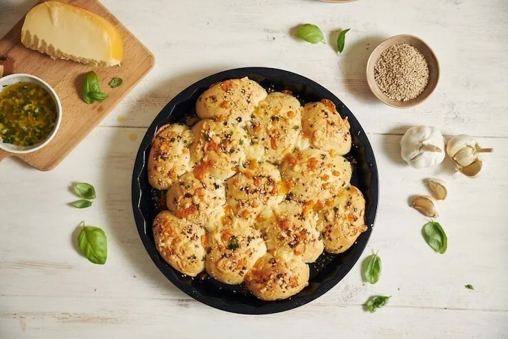 Cheddar garlic herb biscuits with cheese and garlic cloves