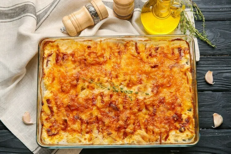 Sausage and zucchini noodle casserole with cheesy ricotta and mozzarella topping