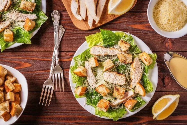 Grilled chicken caesar salad with parmesan cheese