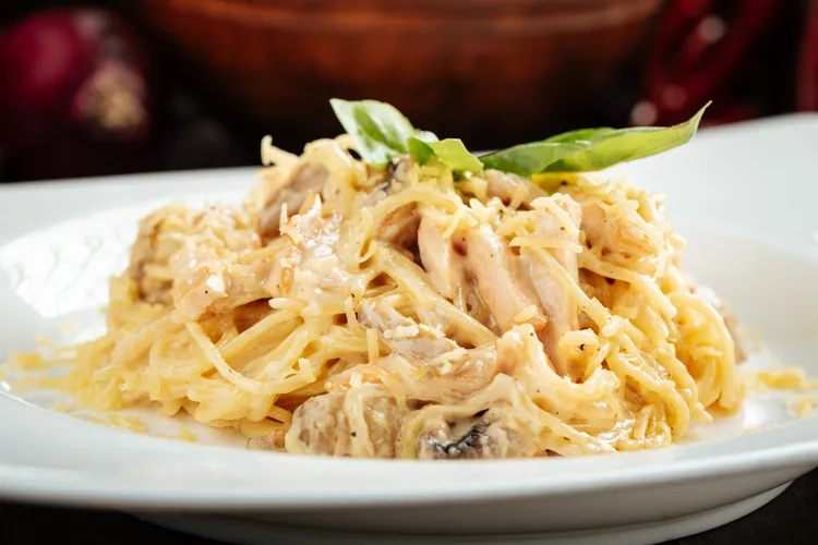 Chicken carbonara with bacon, pine nuts and parmesan cheese