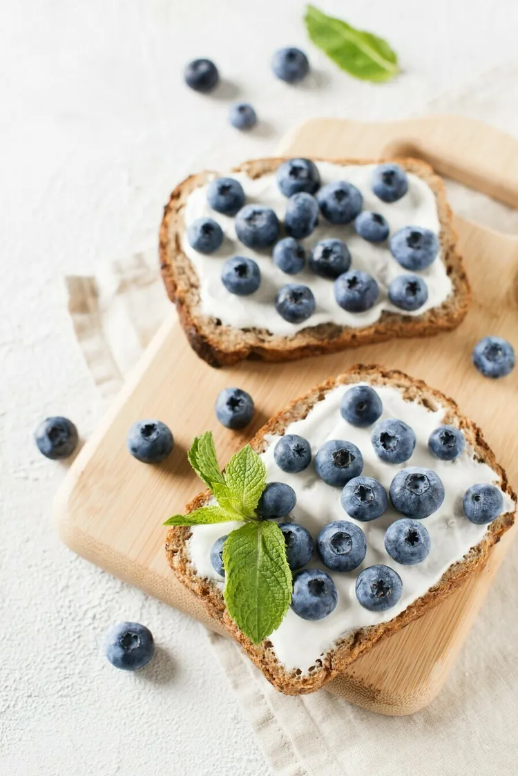 Cinnamon-spiced blueberry and goat cheese toast with sunflower seeds