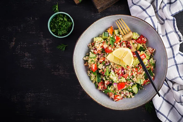 Mediterranean quinoa salad with olives, cucumber and herbs