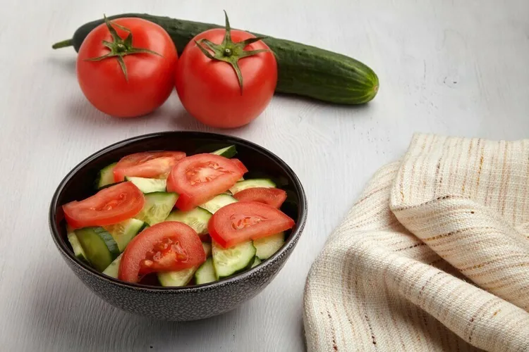 Cucumber and tomato salad with olive oil and vinegar