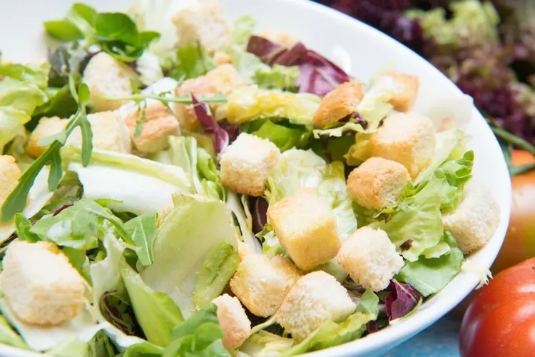 Avocado salad with croutons and sweet corn