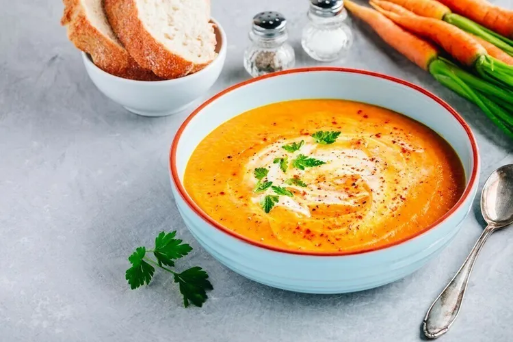 Carrot ginger soup with chives and white pepper