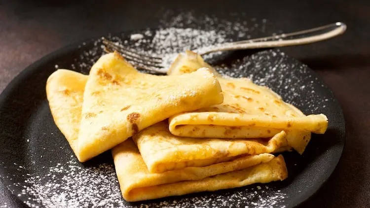Sweet french crêpes with butter and sugar