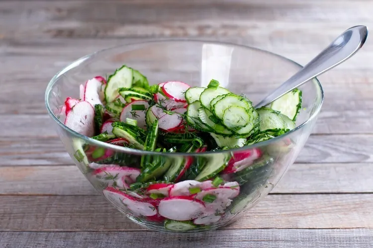Cucumber and radish salad with almonds, parsley and onion in a vinegar and olive oil dressing