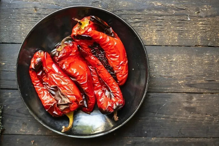Grilled red peppers with olive oil, parsley and seasonings