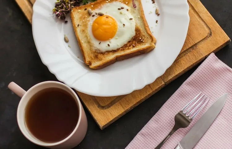Egg in a basket with whole-wheat bread and seasonings