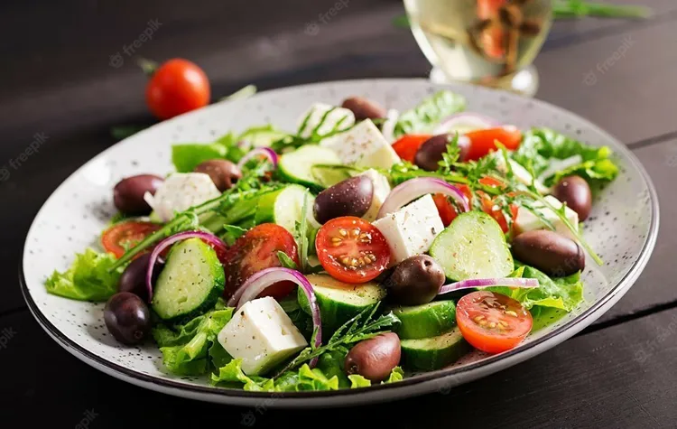 Mediterranean fattoush salad with olives, feta and sesame butter