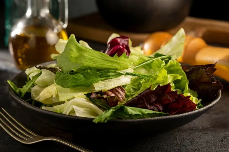 Fresh and zesty green salad with olive oil, vinegar and mustard