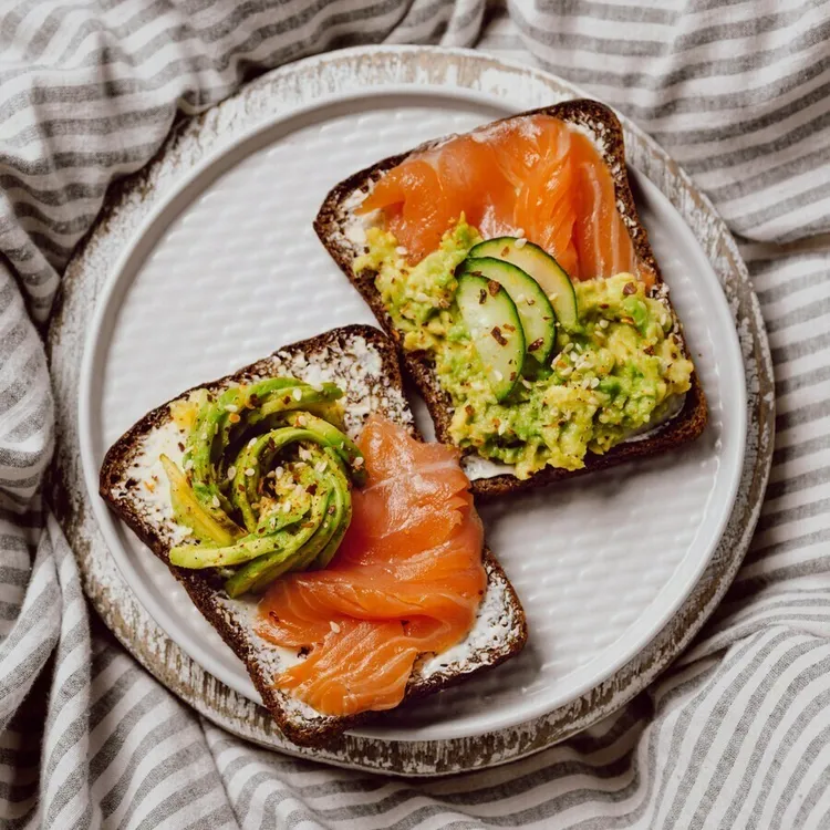 Smoked salmon and avocado egg salad sandwich with cucumber