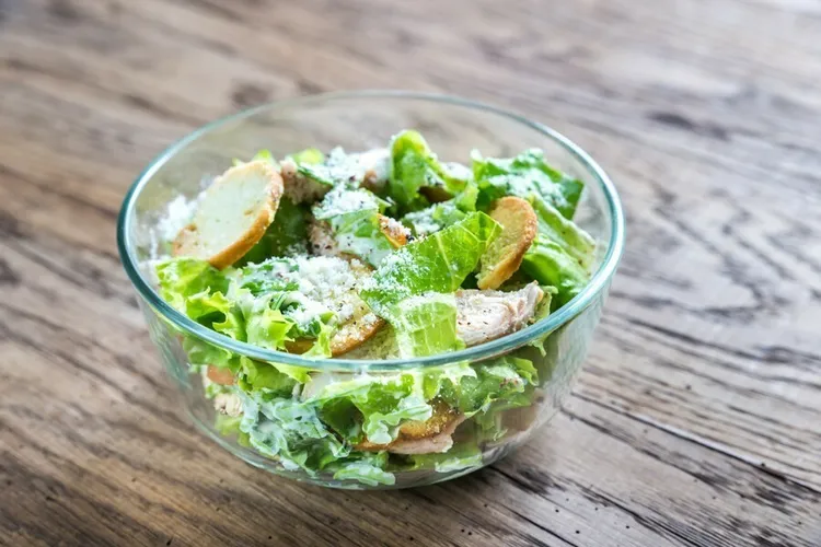 Grilled chicken caesar salad with spinach and parmesan