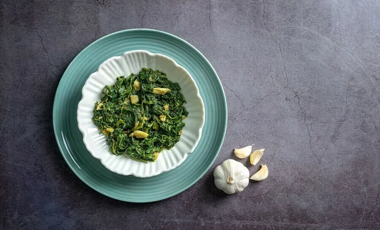 Caramelised onion and garlic kale with olive oil