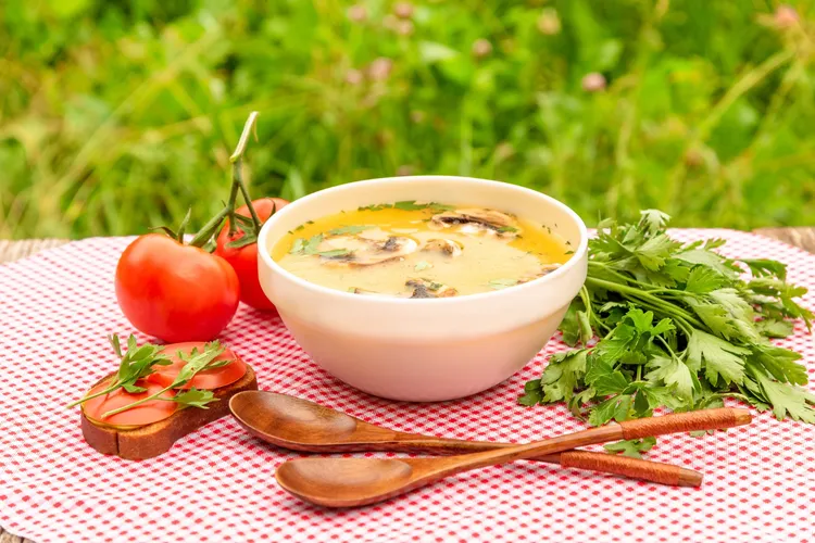 Low-carb crockpot sausage soup with mushrooms, serrano peppers and spinach