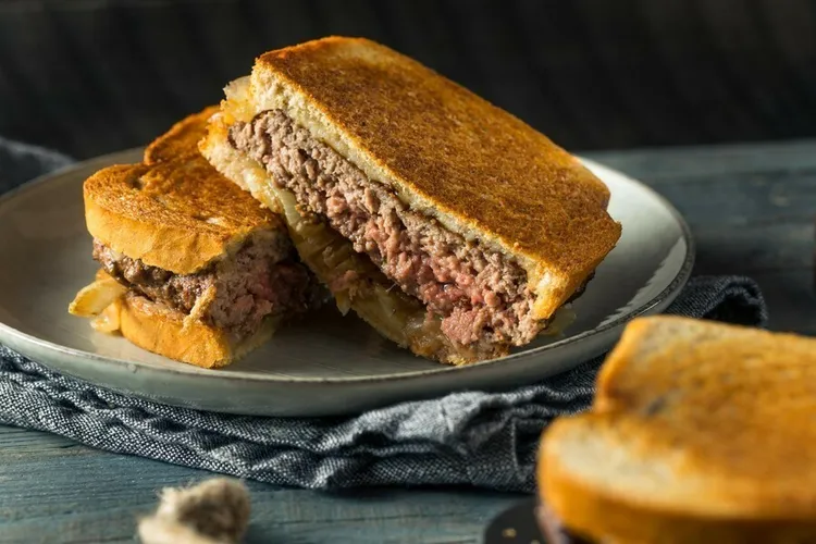 Rye patty melt with swiss cheese and caramelized onions