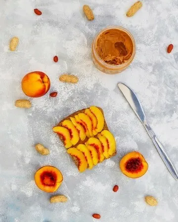 Cinnamon-spiced peaches and almond butter toast