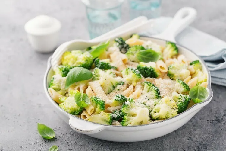 Gluten-free penne primavera with broccoli, carrot and peas