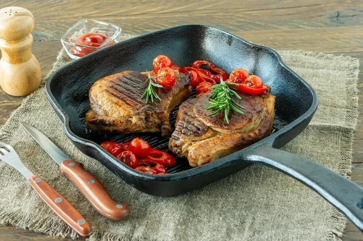 Pan-seared porterhouse steak with cherry tomatoes and basil-thyme sauce