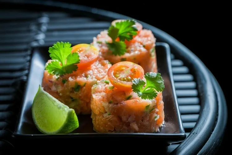 Salmon and avocado ceviche with coconut and arugula