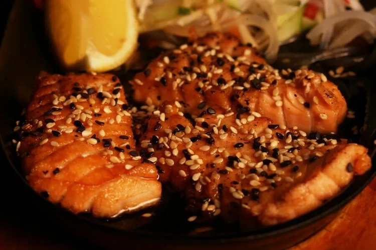 Ginger-sesame crusted wild salmon with coconut milk sauce