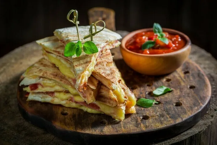 Veggie quesadillas with sour cream and lime