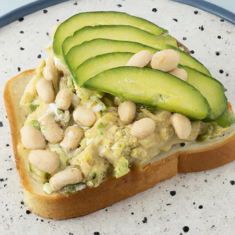 White bean and avocado sandwich with cucumber and alfalfa seeds