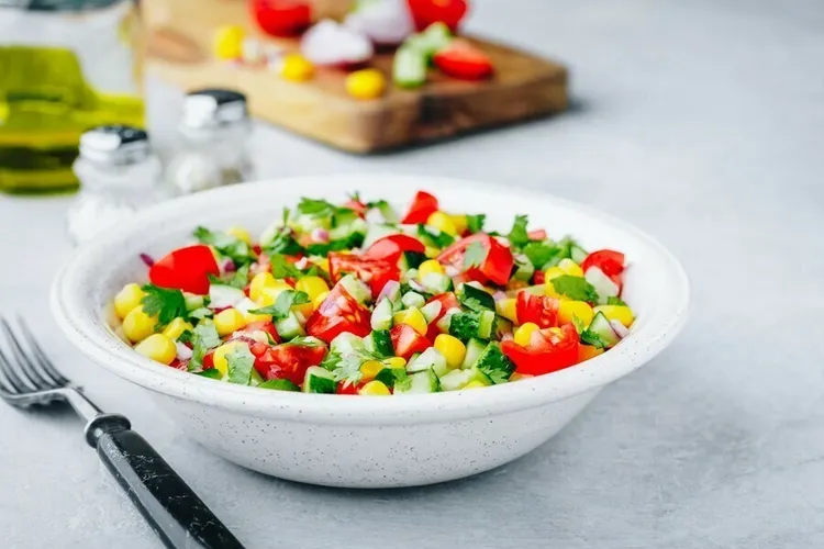 Corn and peppers with buttery onions and tomatoes