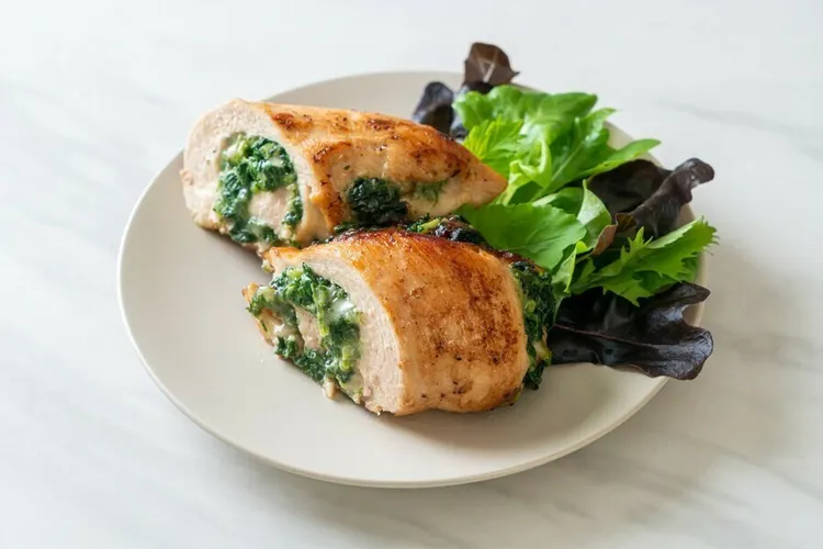 Kale and corn-stuffed chicken breasts with monterey cheese