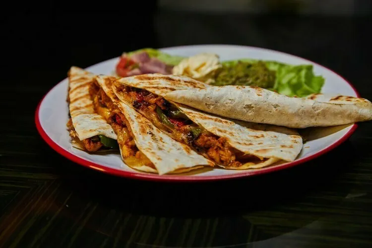 Chicken spinach quesadillas with monterey cheese and salsa sauce
