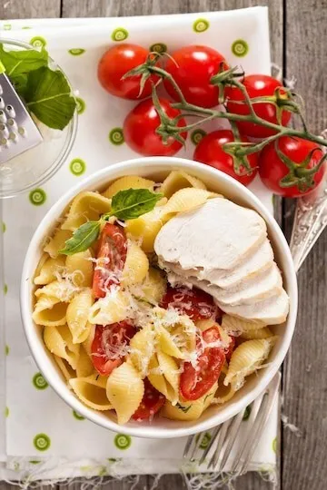 Fresh summer tomato basil pasta with mozzarella and garlic