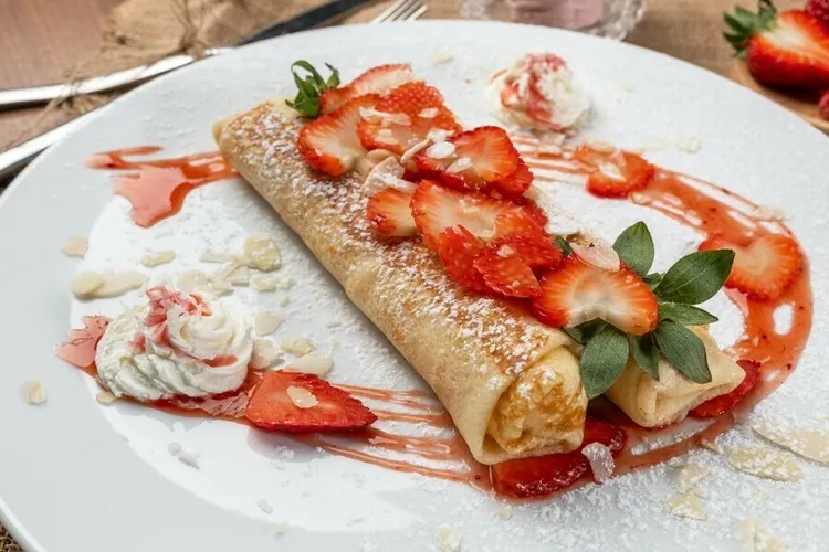 Cream cheese-stuffed sweet wheat pancakes with strawberry topping