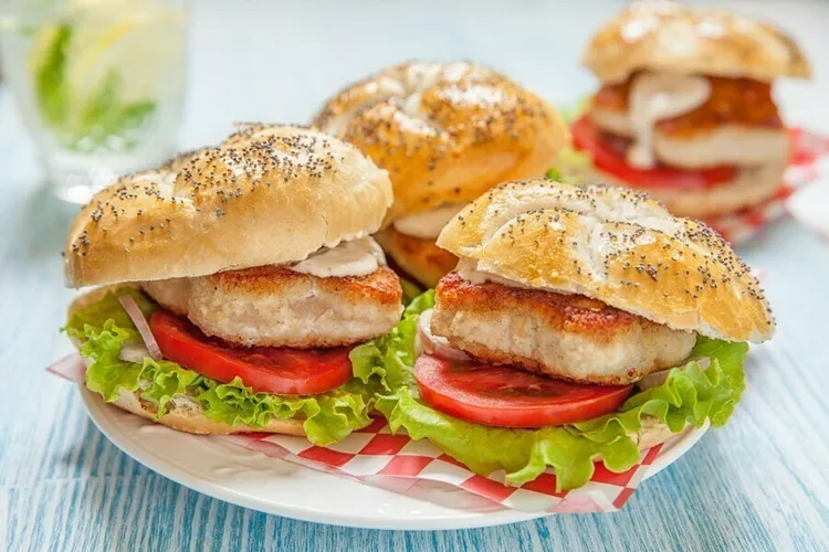 Zucchini turkey burgers with lettuce and tomato on a bun