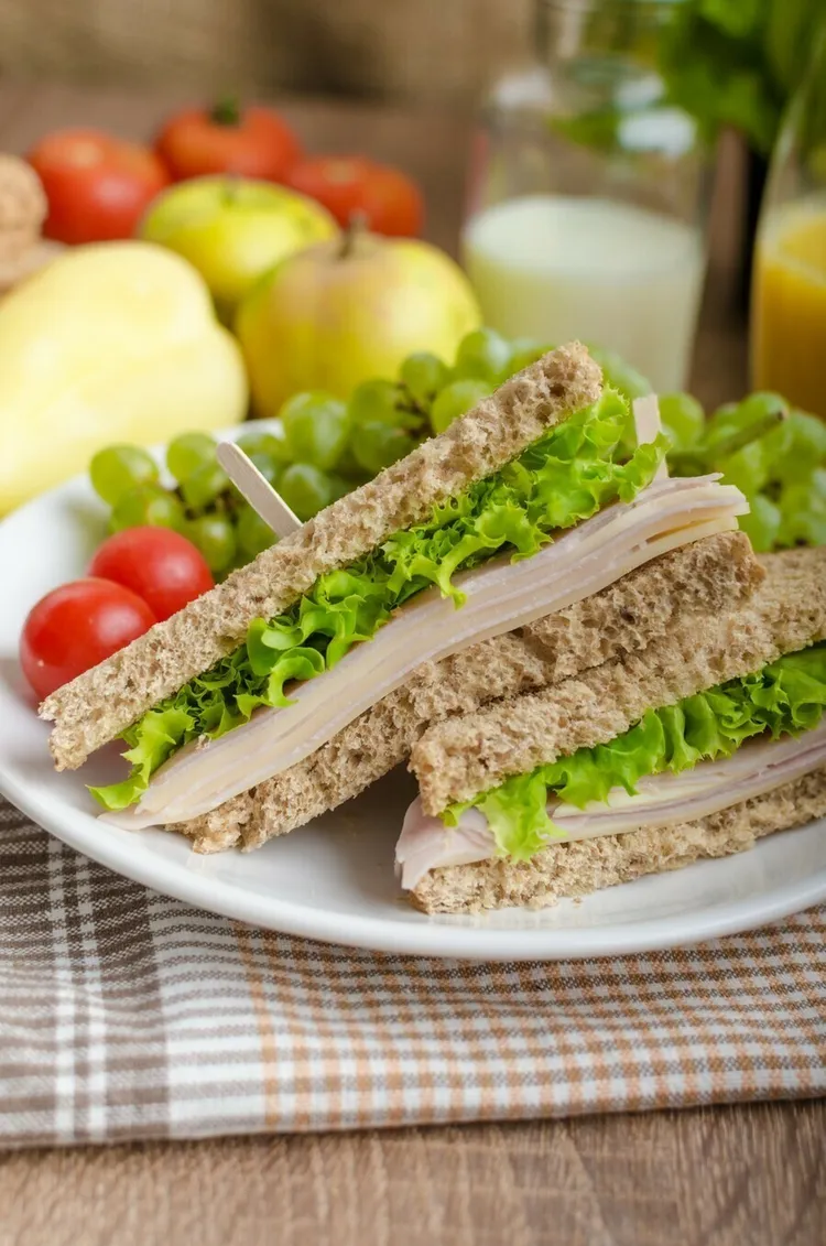 Turkey ham sandwich with mustard and lettuce