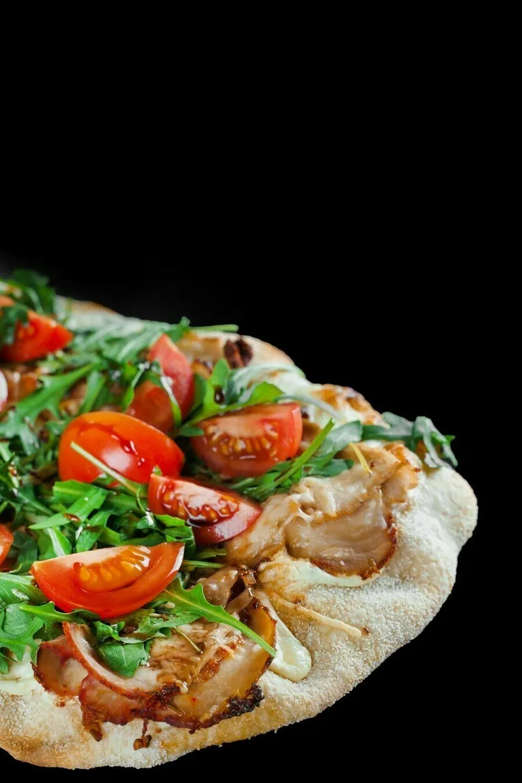Turkey, spinach & tomato pita pizza with basil & mozzarella