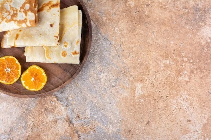 Vanilla-infused whole-grain crepes with butter and milk