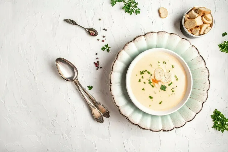Vegan almond soup with grapes and rye bread