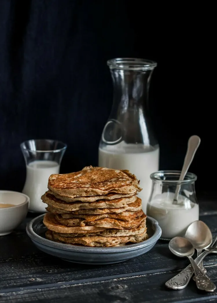 Vegan banana oat pancakes with almond milk and maple syrup