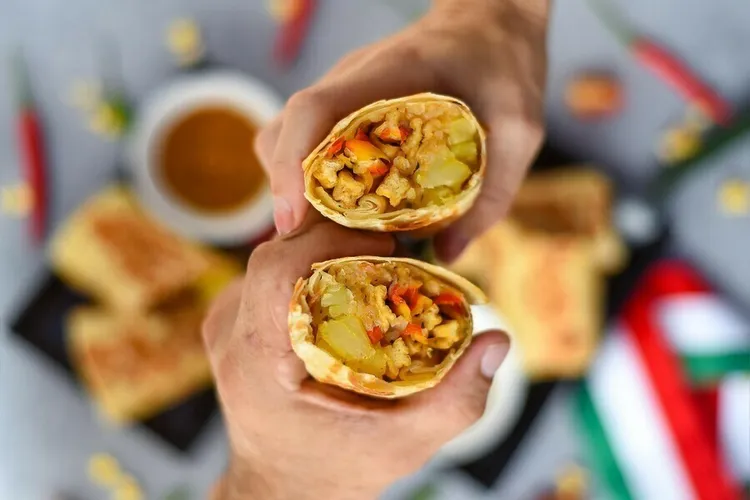 Vegan protein-packed burrito bowl with tofu, potatoes and mushrooms