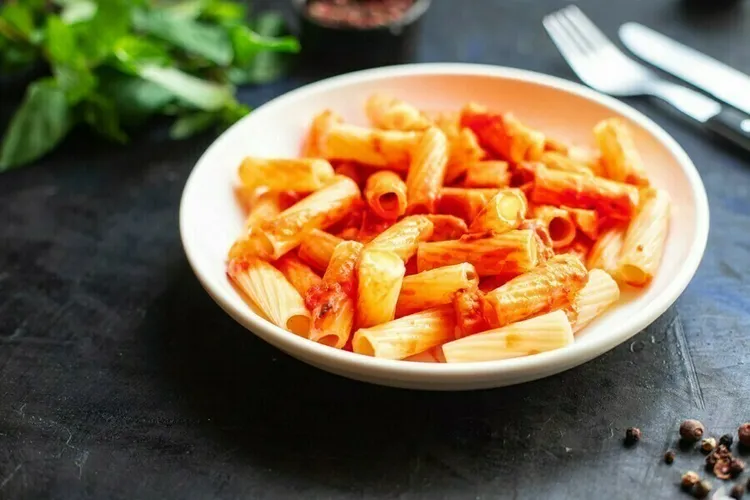 Vegan roasted red pepper pasta with onion, garlic and spices