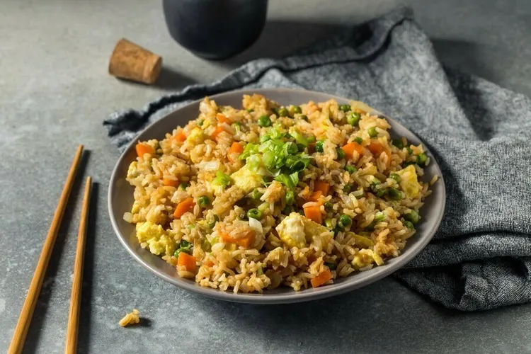 Veggie-packed fried brown rice with carrots, peas and eggs