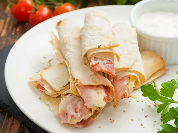 Warm turkey, cheese and sour cream wraps with mozzarella and cheddar